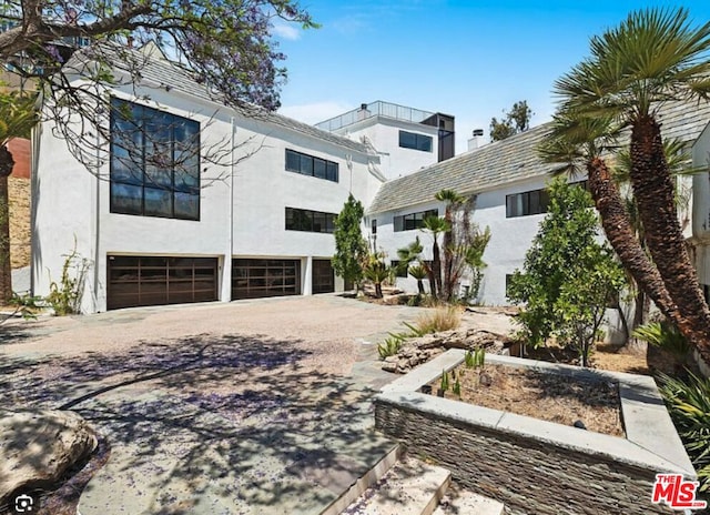 view of front of property featuring a garage