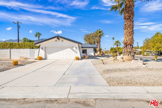 view of front of home with a garage