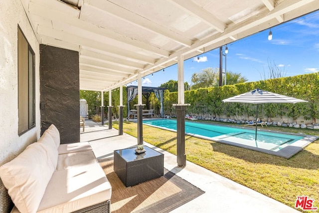 view of patio / terrace with a fenced in pool and outdoor lounge area