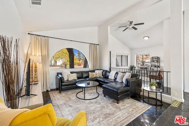 living room featuring ceiling fan and high vaulted ceiling