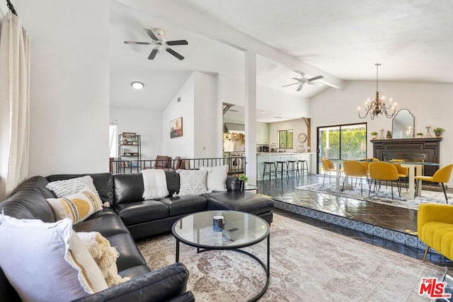 living room featuring beam ceiling, ceiling fan with notable chandelier, and high vaulted ceiling