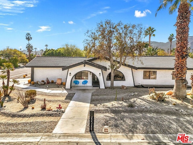 view of front of home featuring a mountain view