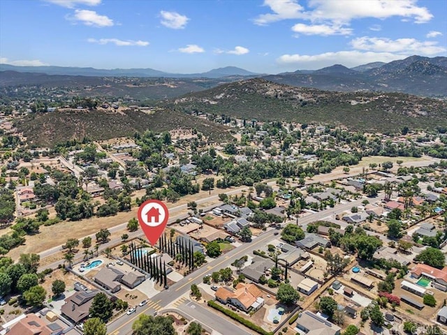 birds eye view of property with a mountain view