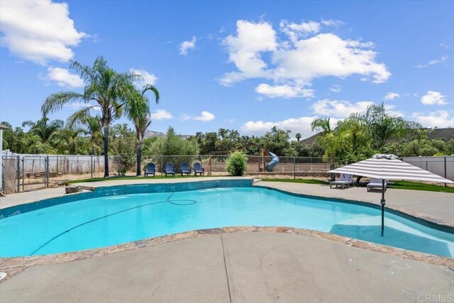 view of swimming pool featuring a patio