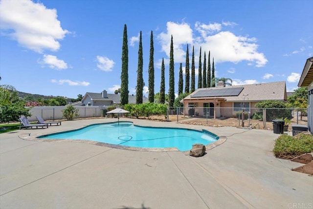 view of swimming pool with a fenced in pool, a patio area, and fence