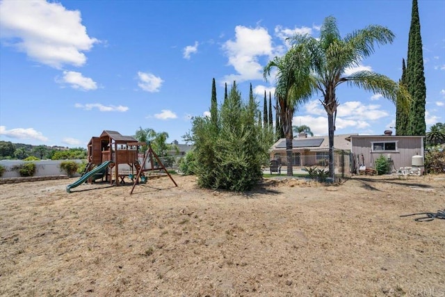 view of jungle gym with fence