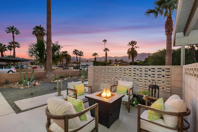 patio terrace at dusk with a fire pit