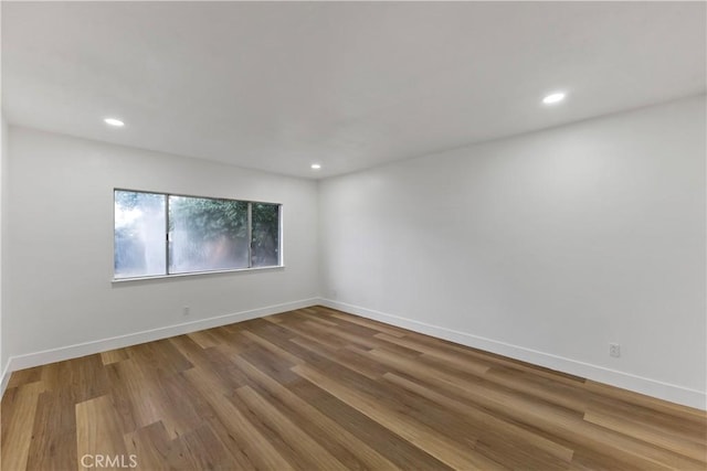 empty room featuring hardwood / wood-style floors