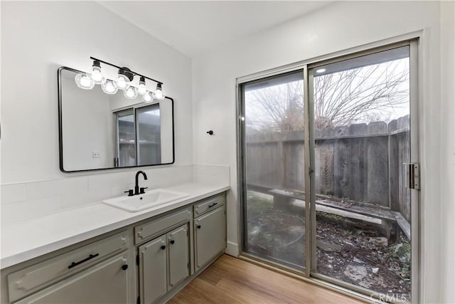 bathroom featuring vanity and hardwood / wood-style floors