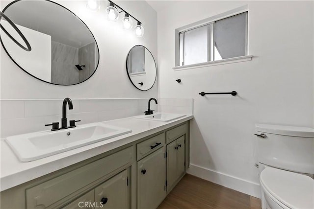 bathroom with vanity, hardwood / wood-style floors, backsplash, and toilet