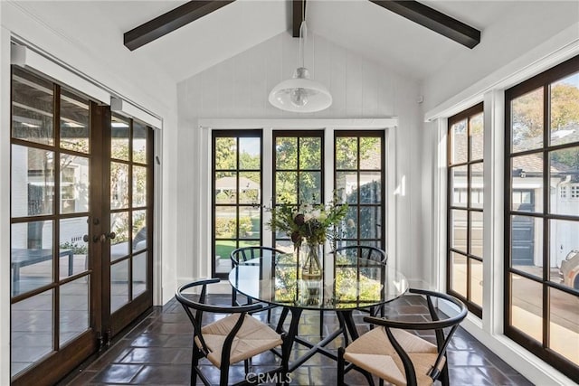 sunroom featuring french doors and vaulted ceiling with beams