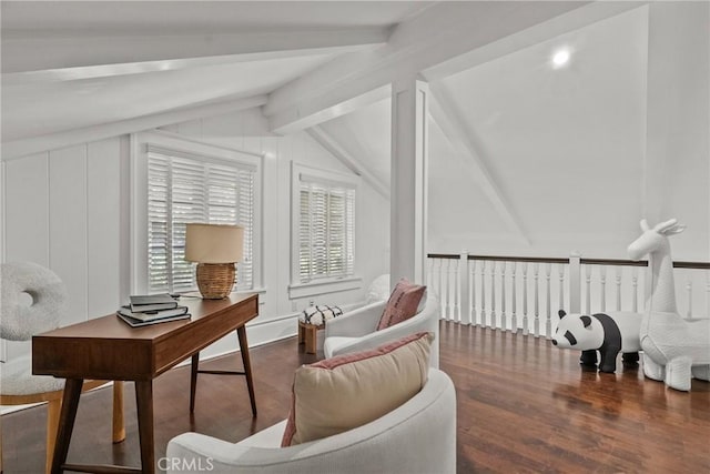 living area featuring dark hardwood / wood-style floors and vaulted ceiling with beams