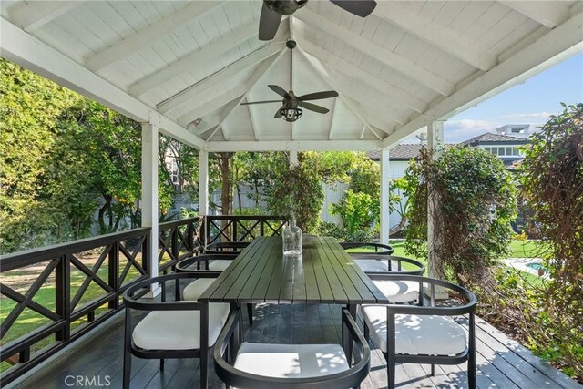 wooden deck with a gazebo and ceiling fan