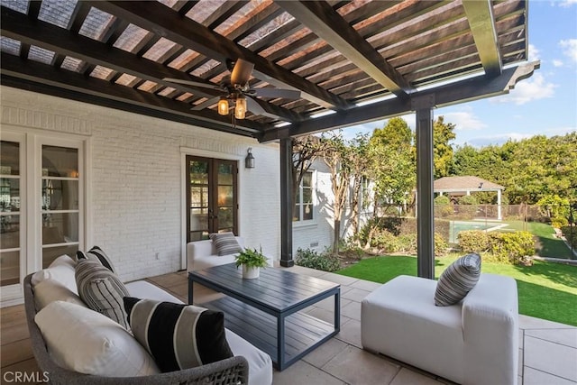 view of patio / terrace with ceiling fan, an outdoor hangout area, and a pergola