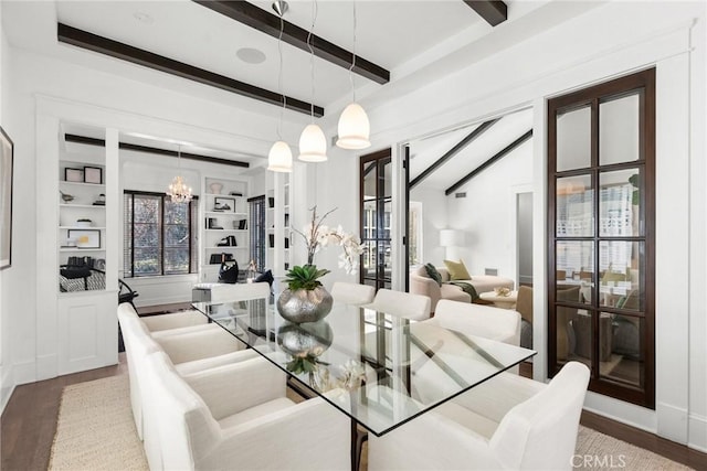 dining room featuring built in shelves, beam ceiling, hardwood / wood-style floors, and a notable chandelier