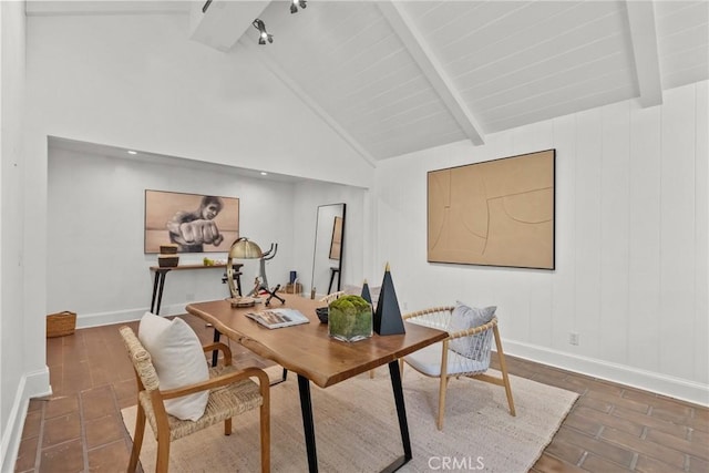 office area featuring vaulted ceiling with beams