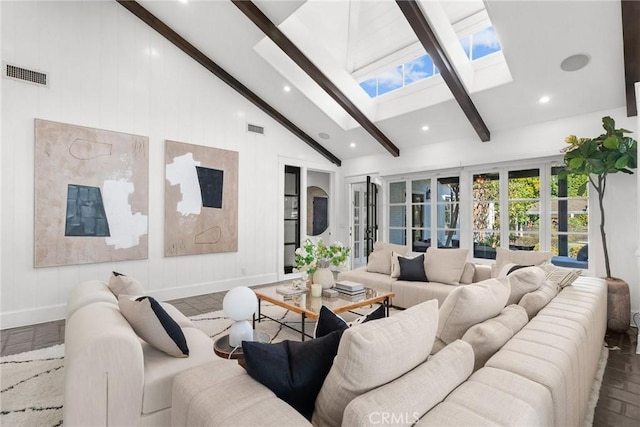 living room with beam ceiling, a skylight, and high vaulted ceiling