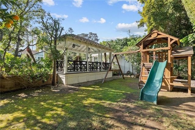 view of play area featuring a gazebo and a lawn