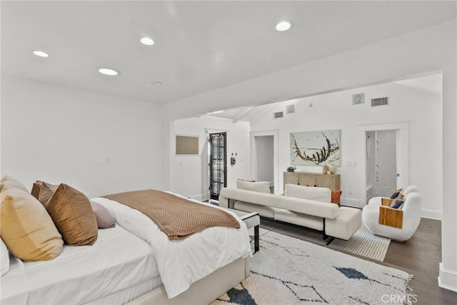 bedroom with dark wood-type flooring and vaulted ceiling