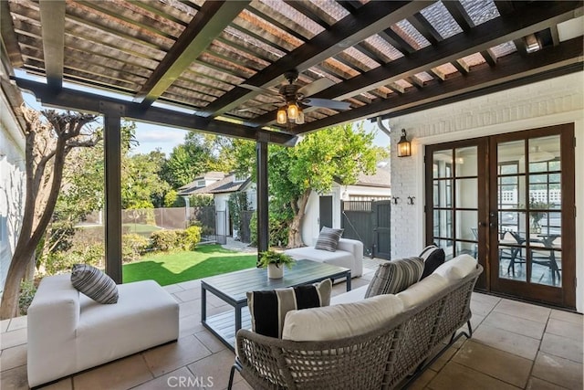 view of patio / terrace with french doors, an outdoor living space, and a pergola