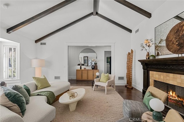 14115 Greenleaf St, Sherman Oaks, CA 91423 - living area with a tiled fireplace, dark wood-style flooring, baseboards, and arched walkways
