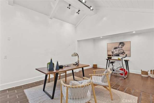 office space with beam ceiling and high vaulted ceiling