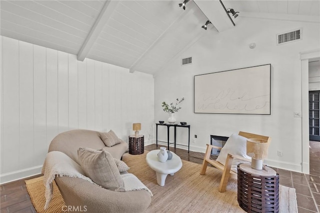 sitting room with wood-type flooring, rail lighting, and lofted ceiling with beams