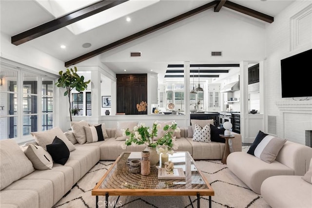 14115 Greenleaf St, Sherman Oaks, CA 91423 - living room with beamed ceiling, plenty of natural light, a skylight, high vaulted ceiling, and recessed lighting