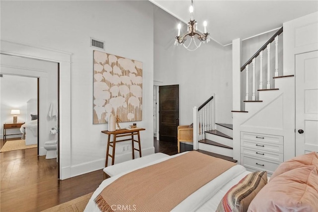 14115 Greenleaf St, Sherman Oaks, CA 91423 - bedroom featuring wood finished floors, baseboards, a chandelier, and a towering ceiling