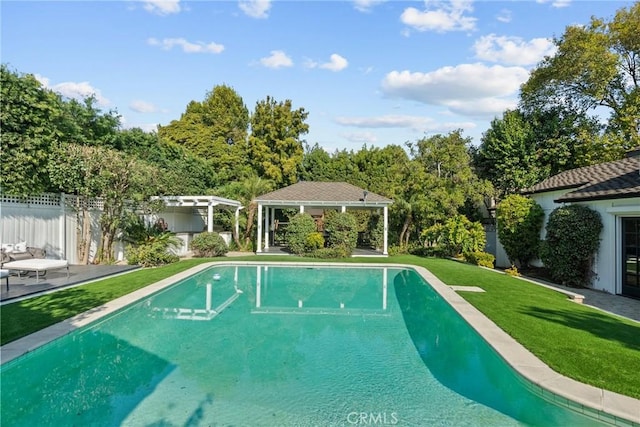 view of swimming pool featuring a gazebo and a yard