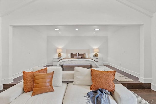 bedroom with dark hardwood / wood-style flooring and vaulted ceiling