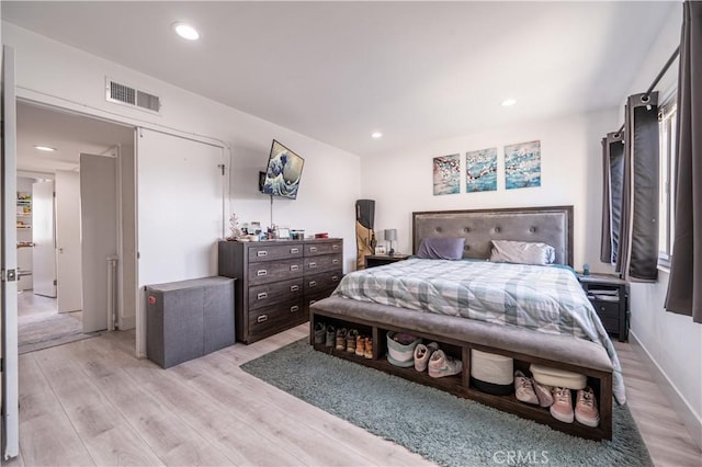 bedroom with light hardwood / wood-style floors