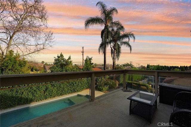 view of patio terrace at dusk