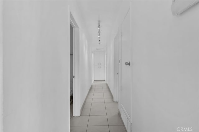 corridor with light tile patterned floors