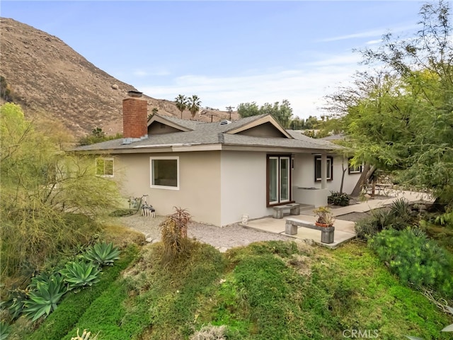 rear view of property featuring a patio area