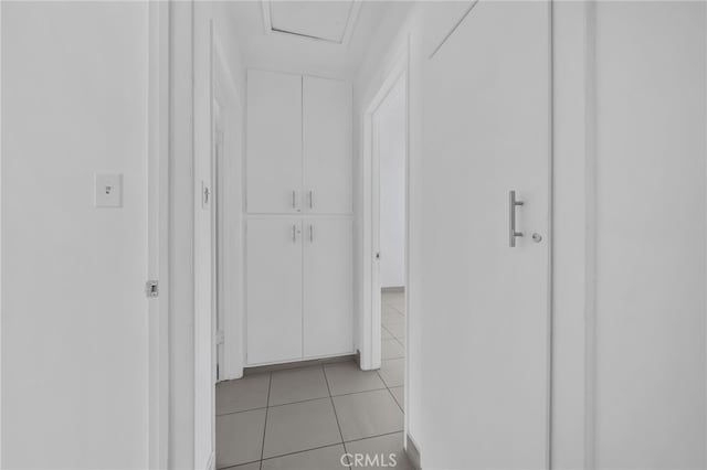 hallway featuring light tile patterned flooring