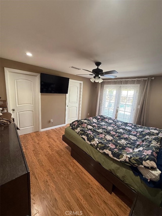 bedroom featuring wood-type flooring and ceiling fan