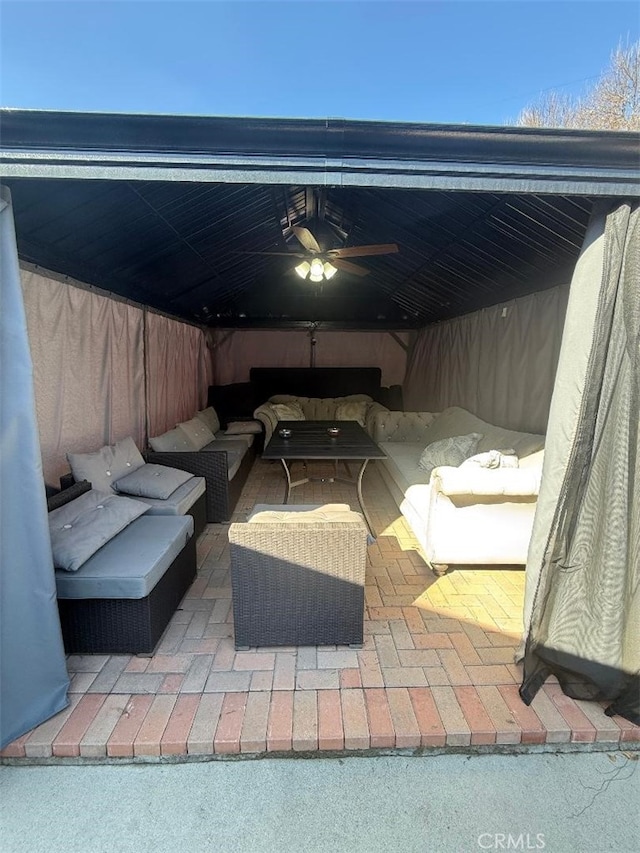 view of patio / terrace with ceiling fan and an outdoor hangout area