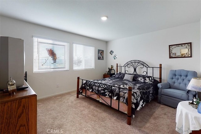 carpeted bedroom with baseboards