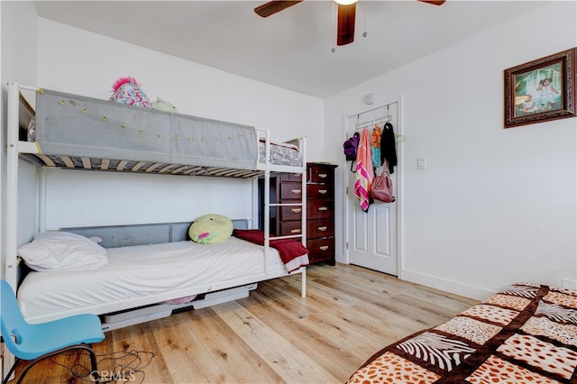 bedroom featuring ceiling fan and light hardwood / wood-style flooring