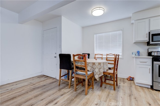 dining area with light hardwood / wood-style flooring