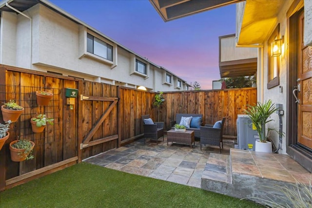 patio terrace at dusk with an outdoor living space