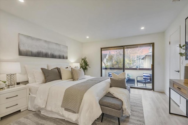 bedroom with access to exterior and light wood-type flooring