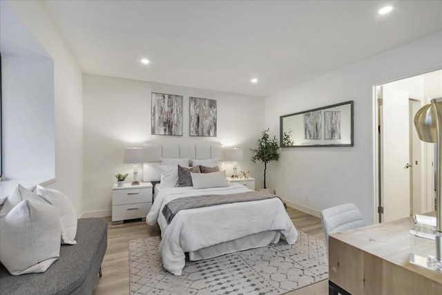 bedroom with light hardwood / wood-style floors