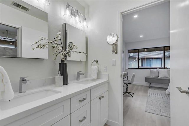 bathroom featuring vanity and wood-type flooring