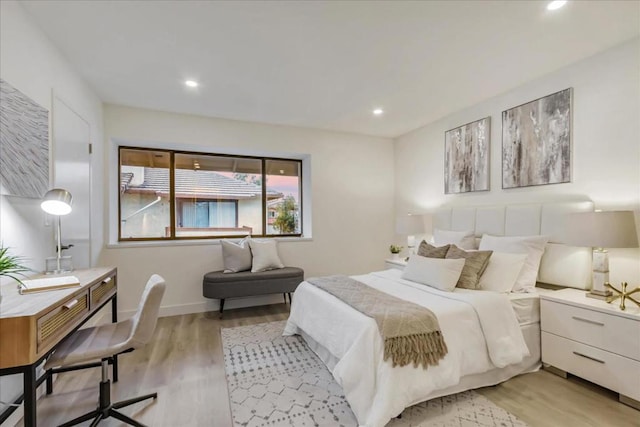 bedroom with light hardwood / wood-style flooring