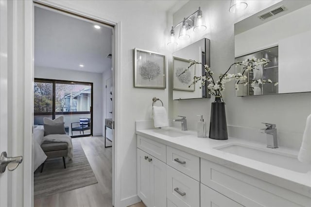 bathroom featuring vanity and wood-type flooring