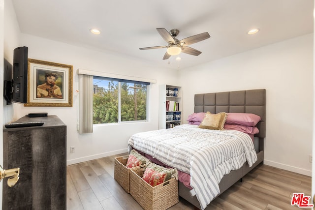 bedroom featuring ceiling fan and light hardwood / wood-style floors