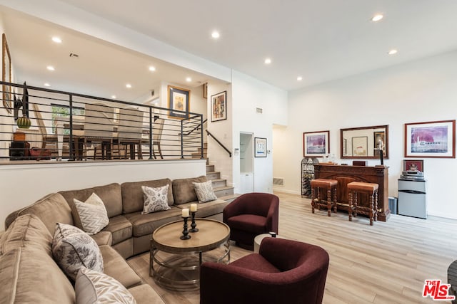 living room with light hardwood / wood-style flooring