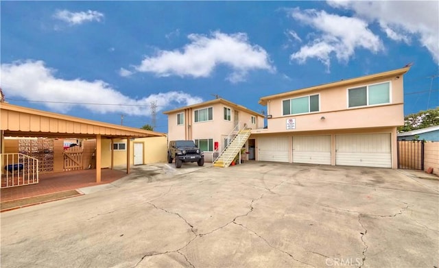 rear view of property featuring a garage